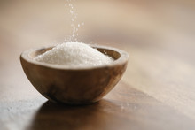 Sugar Pour In Wood Bowl On Wooden Table, With Copy Space