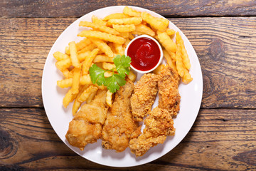 Wall Mural - plate of fried chicken with french fries