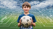 © trattieritratti - Young boy holding a soccer ball and scheme strategy of soccer game on backdrop