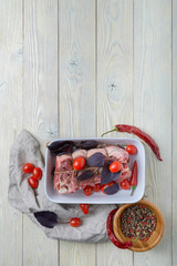 Wall Mural - raw meat with ingredients on a wooden background