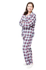 Woman in warm flannel pajamas posing in studio on white background