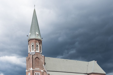 church with storm clouds