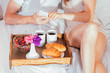 © maryviolet - Couple having breakfast in bed
