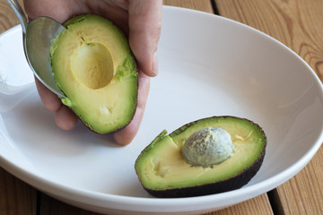 Removing the skin from a ripe avocado