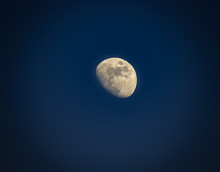 Gibbous Moon Over Dark Blue Sky Seen With A Telescope At Night. Picture With Vignetting.