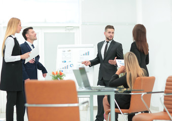 manager of the company holds a working meeting before the busine