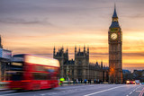 Fototapeta Londyn - London, the UK. Red bus in motion and Big Ben, the Palace of Westminster. The icons of England