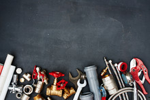 Top View Of The Plumbing Equipment On A Black Background