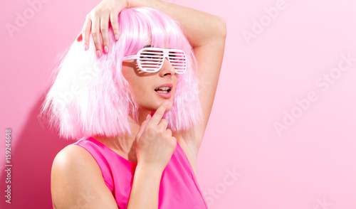 Beautiful woman in a bright pink wig