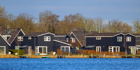 Poster - Black wooden resort houses Terherne