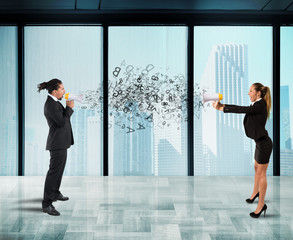 Wall Mural - Two collegues screaming each other with megaphone in office