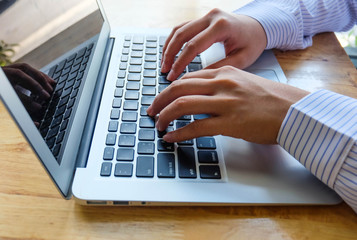 Woman office worker is typing keyboard, business technology and education concept