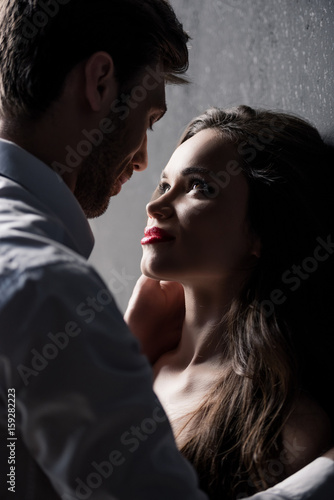 Fotografie, Obraz young sensual couple able to kiss while standing near the wall
