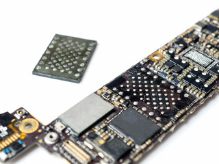 Wall Mural - Close-up image of smartphone logic board removed flash storage (NAND) on white background