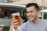 Fototapeta Mapy - Man looking at his cold refreshing beer
