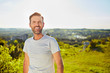 © baranq - Portrait of smiling man during summer walk outdoors