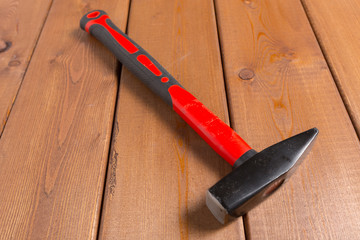 Wall Mural - hammer on wooden background. Top view