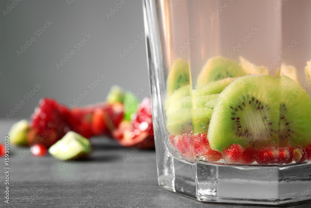 Glass jug with fresh citrus cocktail, closeup
