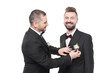 © LIGHTFIELD STUDIOS - couple of grooms in tuxedos preparing to wedding day isolated on white