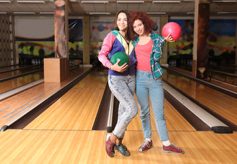 Wall Mural - Friends having fun and playing bowling