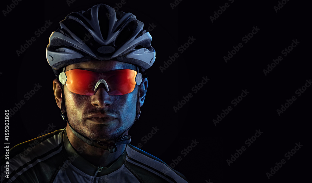 Cyclist. Dramatic close-up portrait - obrazy, fototapety, plakaty 