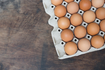 Wall Mural - Chicken egg on wooden background with copy space