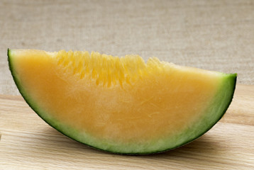 Wall Mural - Fresh melons sliced on wooden table