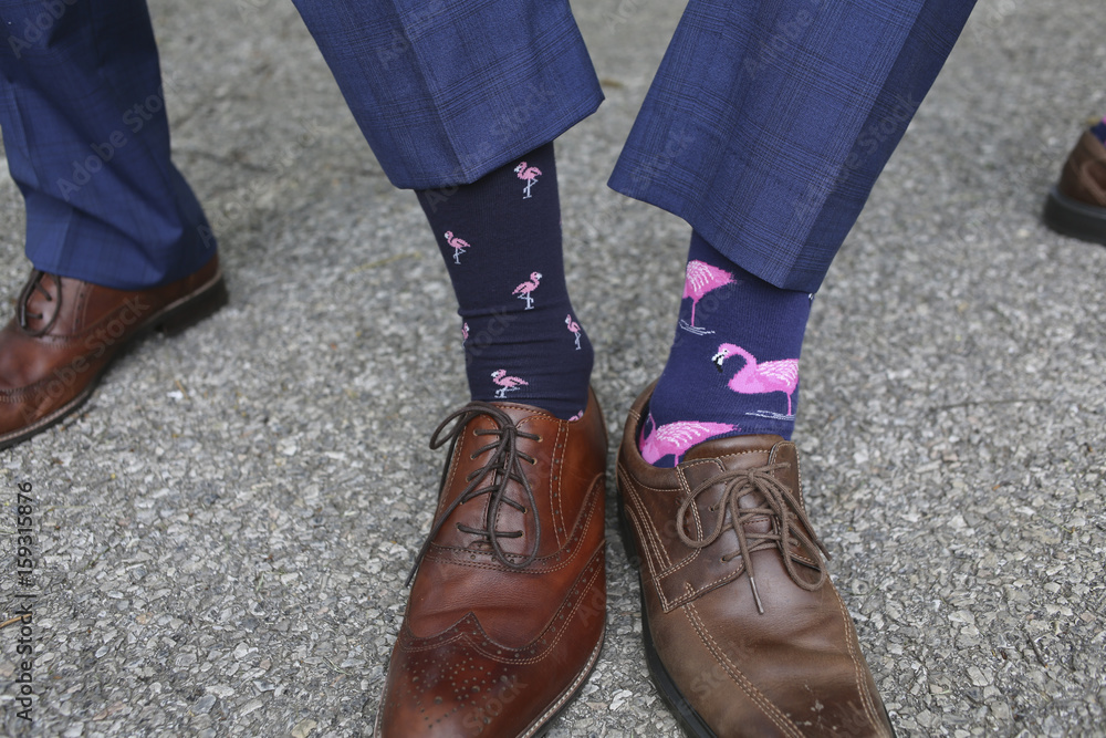 Groom and Groomsmen in Blue Suits Comparing Pink Flamingo Socks Stock Photo | Adobe Stock Groom and Groomsmen in Blue Suits Comparing Pink Flamingo Socks Stock Photo | Adobe Stock