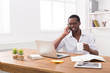 © Prostock-studio - Young black businessman call mobile phone in modern white office