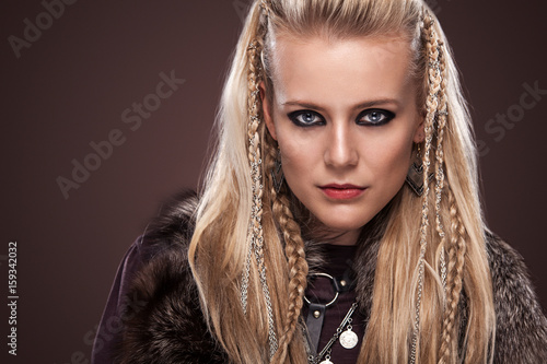 Fotografie, Obraz Portrait of viking woman in a traditional warrior clothes.