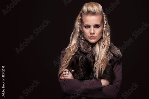Fotografie, Obraz Portrait of viking woman in a traditional warrior clothes.