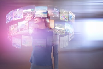 Poster - Composite image of woman experiencing virtual reality headset