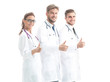 © ASDF - Portrait of group of smiling hospital colleagues standing togeth