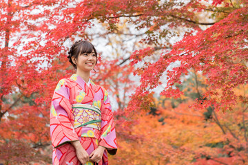 portrait of young asian woman waering kimono in autumn