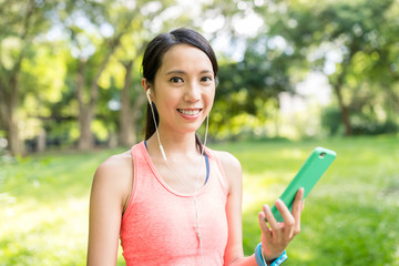 Wall Mural - Woman listen to music at park