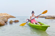 Women kayaking in the sea
