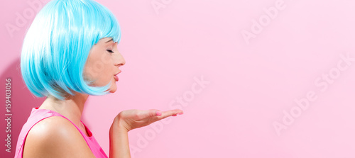 Portrait of a woman in a bright blue wig
