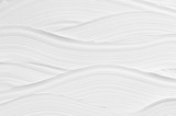 Fototapeta  - White wave plaster texture. Light modern abstract background.