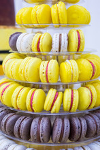 Yellow, White And Brown Cake Macrons On Stand For Kids Birthday Party