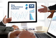 © onephoto - KPI acronym (Key Performance Indicator) Business team hands at work with financial reports and a laptop