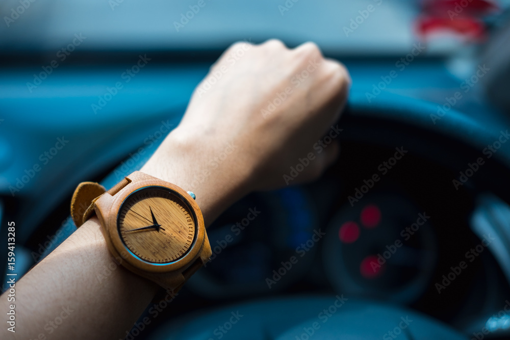 Business Woman Hand Wearing Wooden Wrist Watch Her Holding Steering business-woman-hand-wearing-wooden-wrist-watch-her-holding-steering