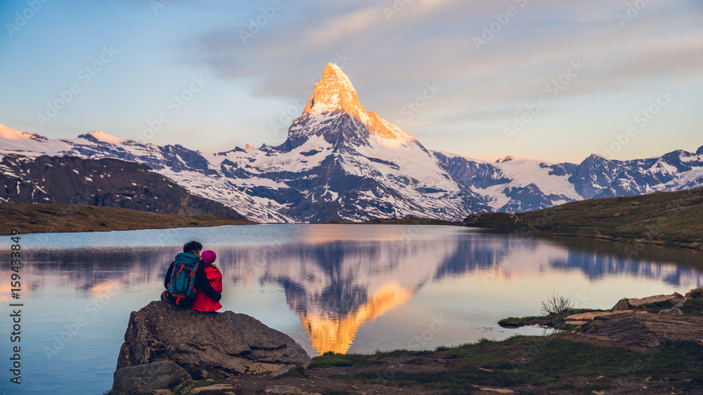 Romantic couple at sunrise, from lake Stellisee, Swiss Alps , Matterhorn Peak, Zermatt, 2017 - obrazy, fototapety, plakaty 