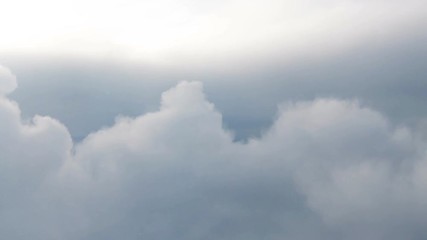 Wall Mural - clouds while flight.view through an airplane window.