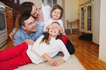 Wall Mural - happy family at home on the floor