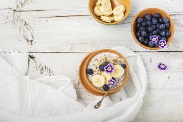 Wall Mural - Sweet milk porridge quinoa with honey and walnuts. Top view