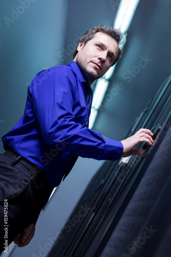 Fotografie, Obraz Confident pleasant man entering the password