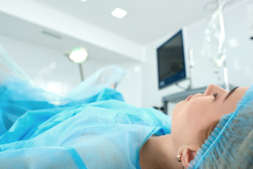 Cropped close up of a woman lying in operating theatre during surgery copyspace patient anesthetic asleep sleeping healthcare sterile surgical medical medicine clinical concept.