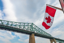 Montreal Jacques Cartier Bridge And Canadian Flag