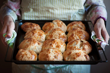 freshly baked bread in bakers hands