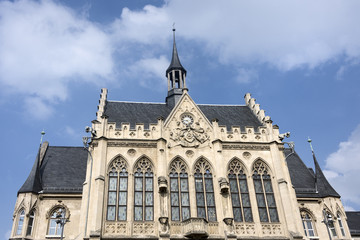 Germany, Erfurt, near Fischmarkt: Front facade with clock of the Town Hall in the center of the capital of Thuringia with blue sky in the background